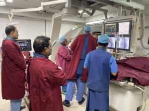 Inside the catheterization lab, the cardiologists are performing an interventional catheterization on a child with heart disease.