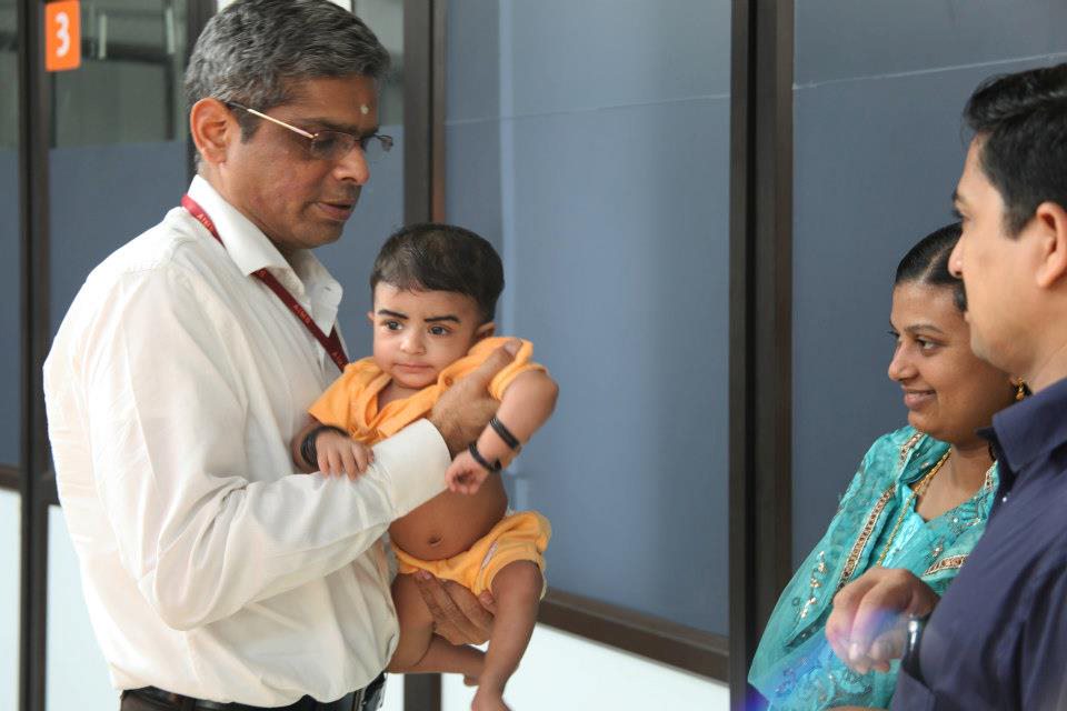 Dr. Kumar with patient and patient's family