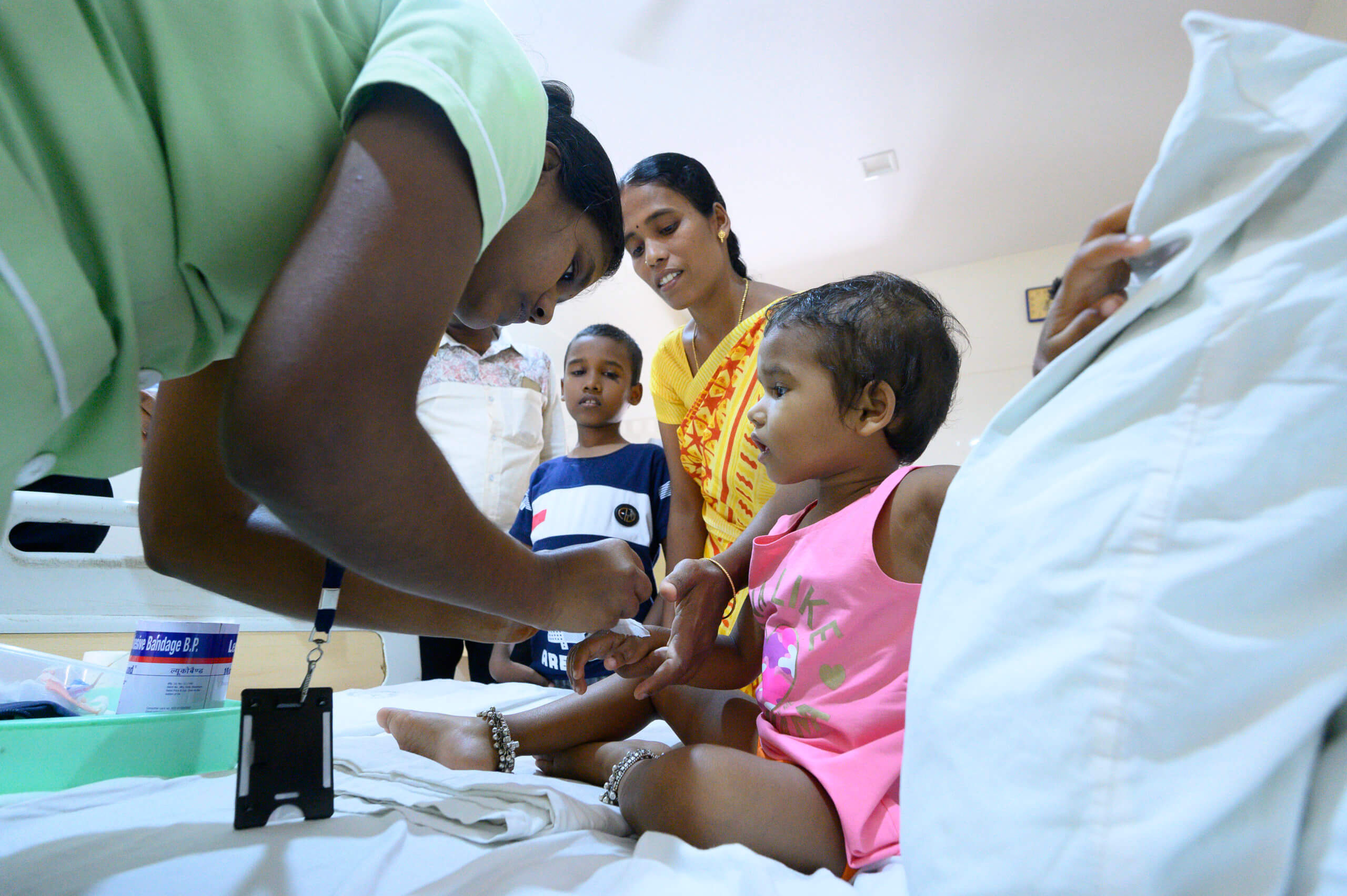 child-in-hospital-bed-receiving-car