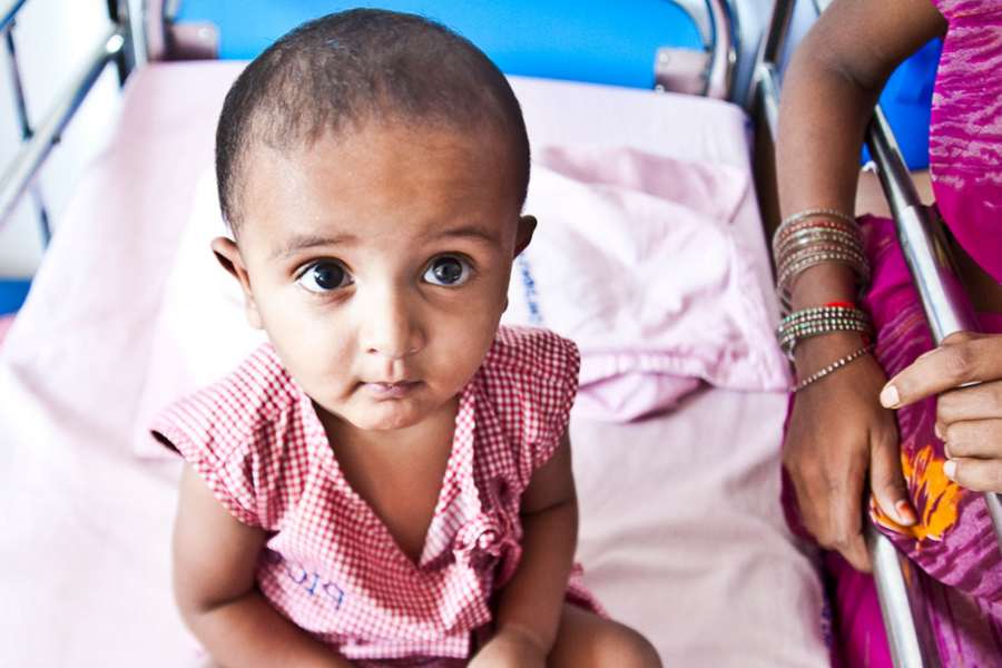 child-in-hospital-bed-receiving-care