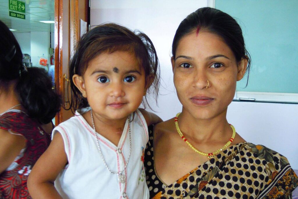 mother-holding-child-india