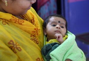 mother-holding-baby-india-kerala