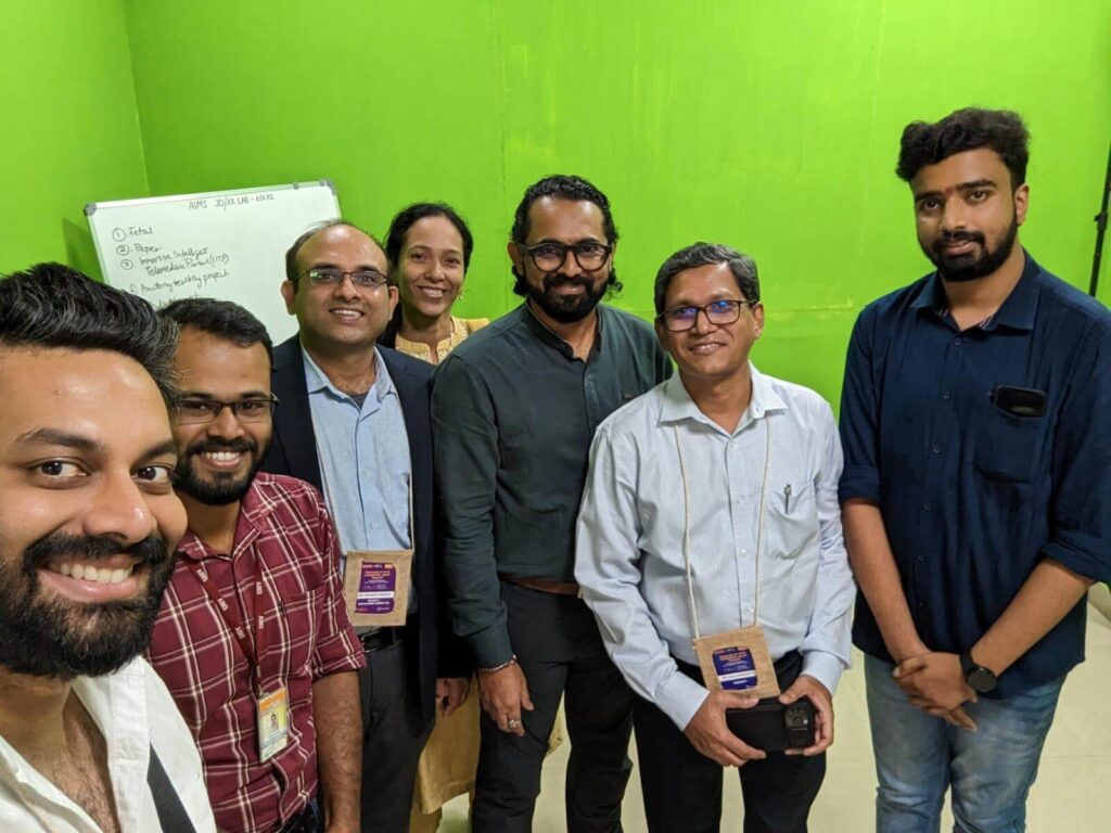 Kartheek (left) on a tour of the VR lab with a group that included Hari (right), Dr. Mahesh (second from right).