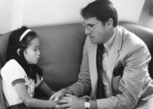 Dr. Kiser with a young patient in the 1970s